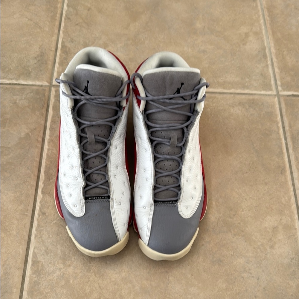 Gray and White Sneakers with Red Accents